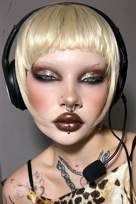 selfie of a beautiful woman with an edgy, punk makeup look and punk ...