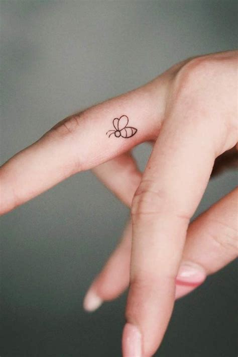 Bow Tattoos On Middle Finger