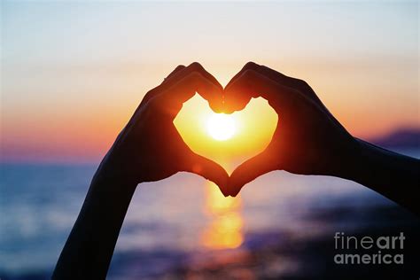 Hands Forming A Heart Shape With Sunset Photograph by Teraphim | Fine ...