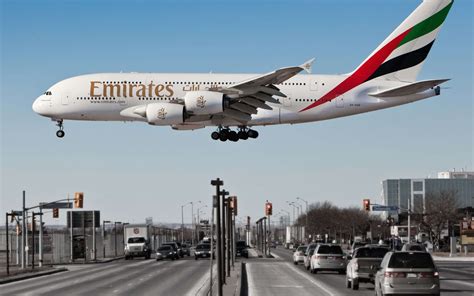 Emirates Airbus A380 HD Wallpaper Over Urban Landscape