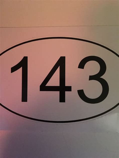 a close up of a sign with the number thirteen on it's back side