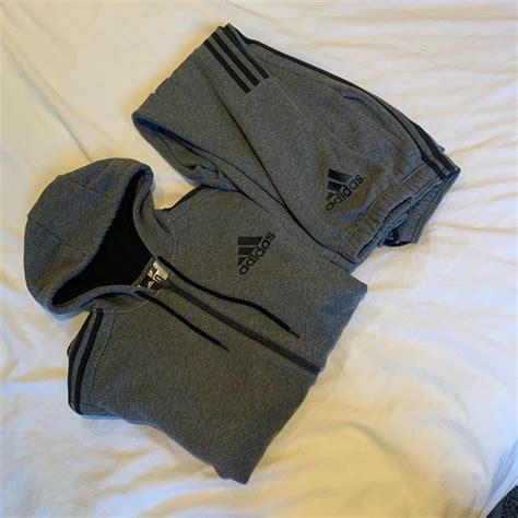 Grey Adidas tracksuit. Hoodie size medium bottoms... - Depop