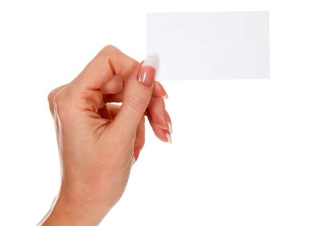 Female hand holding a blank business card, isolated 22129884 PNG