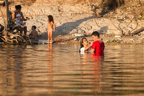 People bath in the Xingu river in Sao Felix do Xingu, Para state ...