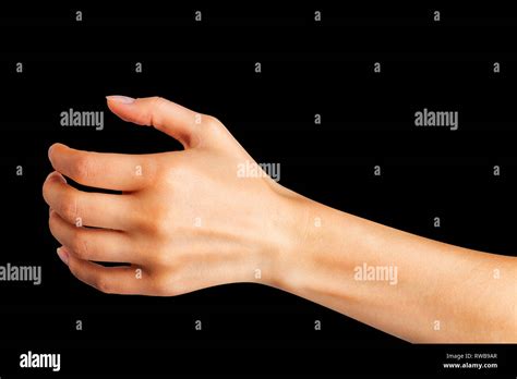 Woman hand holding something like a bottle or glass Stock Photo - Alamy