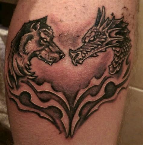 Dragon and wolf leg tattoo | Leg tattoos, Tattoo designs, Dragon tattoo ...