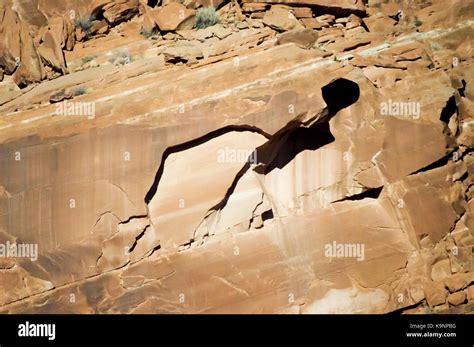 A rocky outcrop formation inset with heavy shadows Stock Photo - Alamy