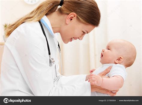 Young Joyful Doctor Holding Baby Girl Smiling Hospital Stock Photo by ...