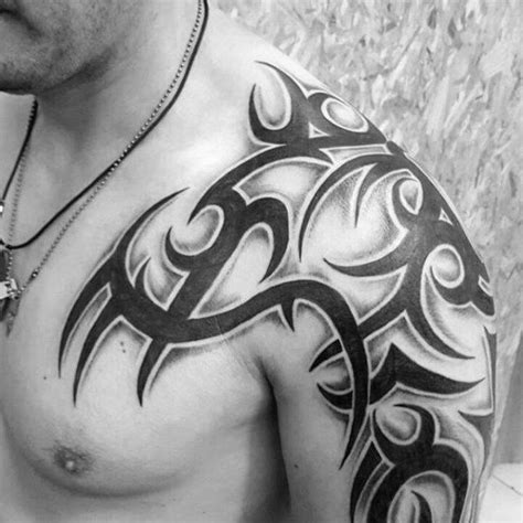 a man with a tattoo on his chest