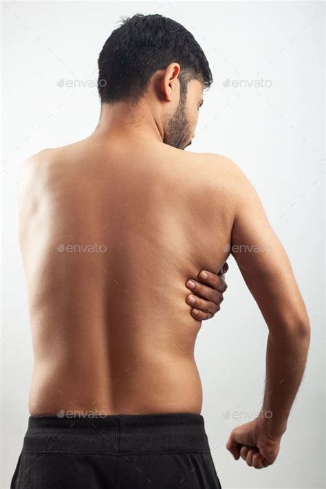 Latissimus Doris injury or lats muscle pain, indian man clutching his ...