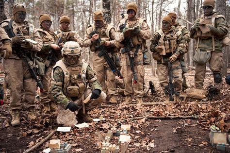 U.S. Marine Corps officers receive a briefing during urban operations ...