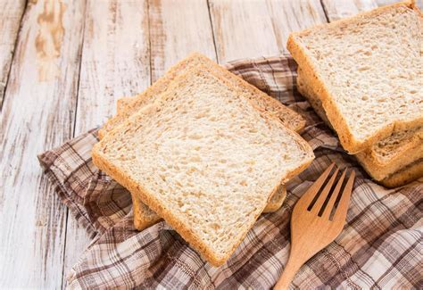 Whole wheat bread on white wooden background 6426142 Stock Photo at ...