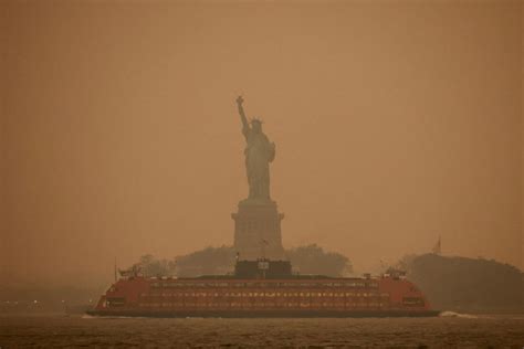 PHOTOS: Skies over Canada and U.S. darkened by hazardous wildfire haze ...