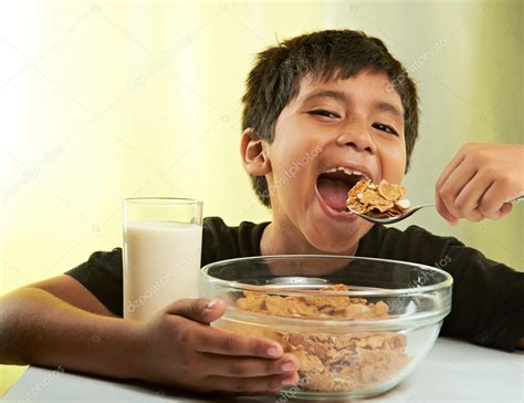 Boy having breakfast Stock Photo by ©dimarik 118296692