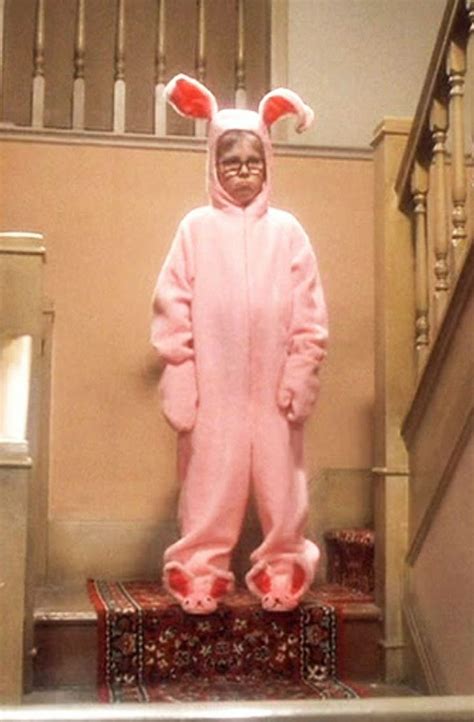 a person in a pink bunny costume standing on some stairs