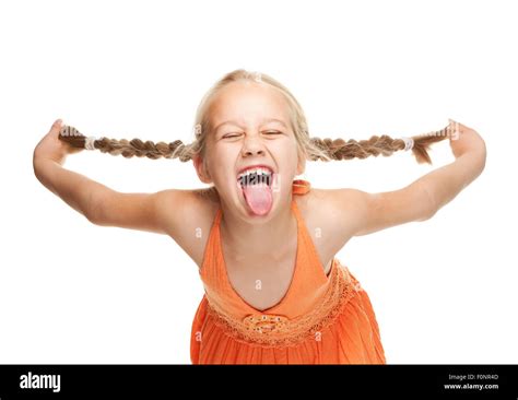 Little girl making funny face Stock Photo - Alamy