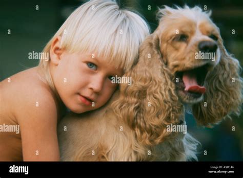 child hugging dog Stock Photo - Alamy