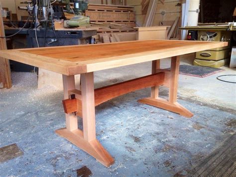 This beautiful trestle dining room table is made of solid wood and it ...