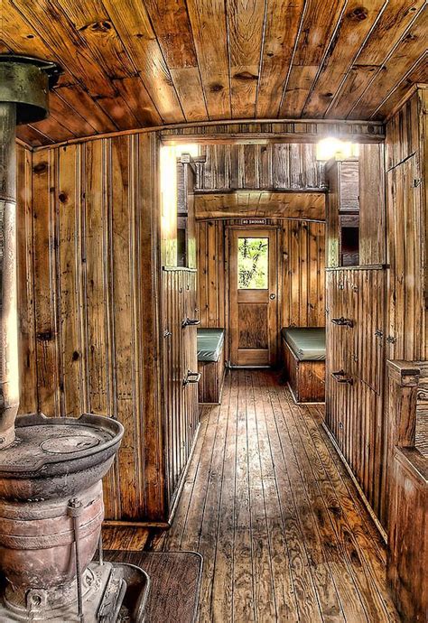 the inside of an old wooden cabin with wood floors