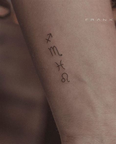 Minimalist zodiac symbols tattoo on the wrist