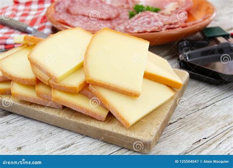 Raclette cheese stock image. Image of salami, background - 125504047