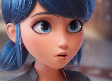 a close up of a doll with blue hair and big round eyes, looking at the ...