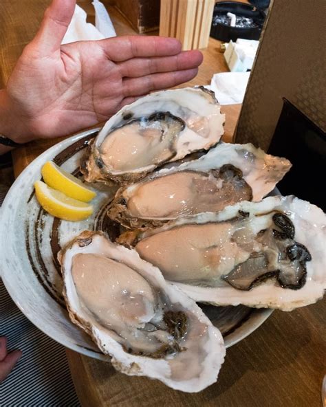 Giant oysters at Daiyasu in Kyoto. We go every time. Hand for size ...