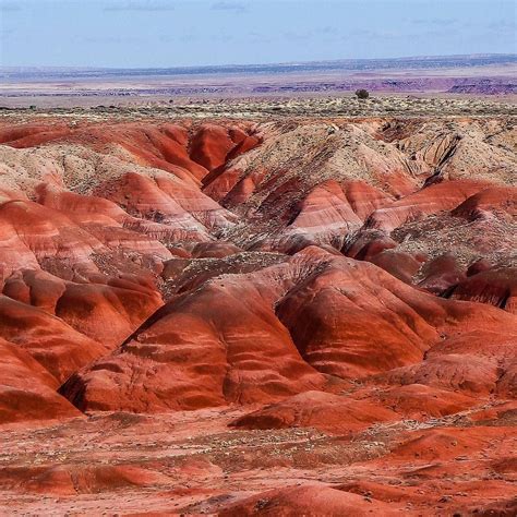 The Painted Desert is a huge expanse of badland hills and buttes in ...