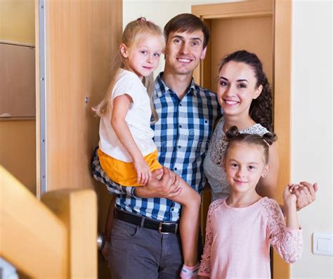 Middle Class Family in New House Stock Photo - Image of doorway ...