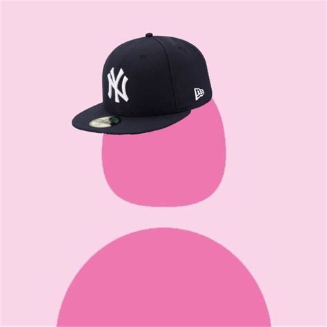 a new york yankees cap on a pink background