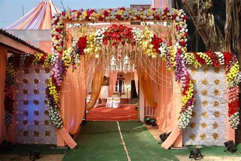 Outdoor Wedding Venue Decorated with Flowers and Garlands