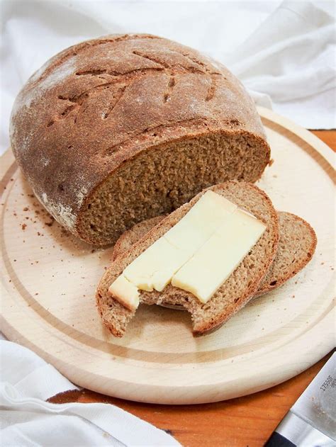 sourdough rye bread with slice topped with cheese | Rye bread recipes ...