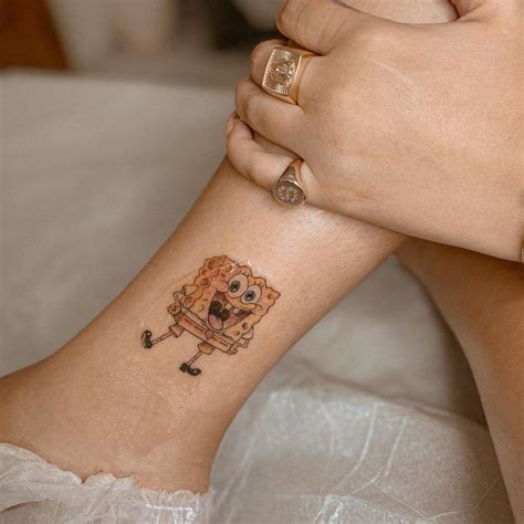 SpongeBob tattoo on the ankle.