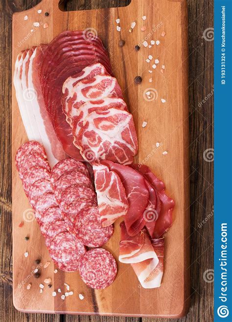 The Various Types of Meat and Sausages on Wooden Table Stock Photo ...