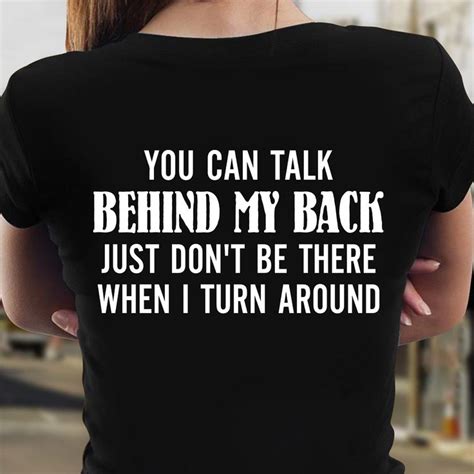 the back of a woman's black shirt that says, you can talk behind my ...