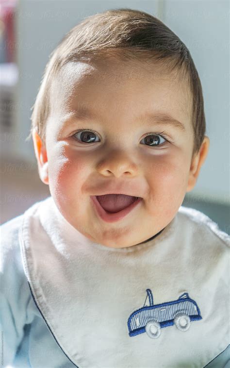 "Happy Baby Smiling" by Stocksy Contributor "ACALU Studio" - Stocksy