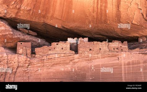 Historic native anasazi cave dwellings built in a sandstone cliff in ...