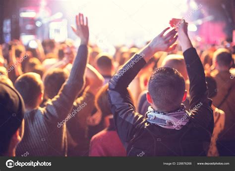 A concert crowd of people applauds the artist. Stock Photo by ©rrvachov ...