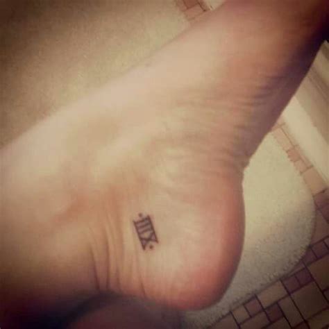 This was my first tattoo. Its roman numeral 13 and I got it in ...