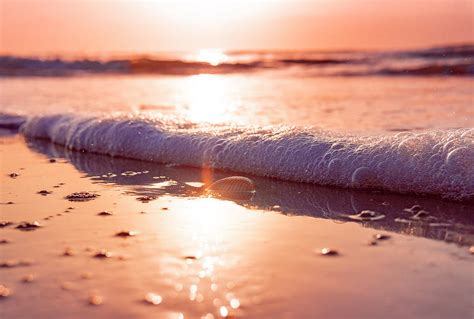 Beautiful Relaxing Ocean Beach Sand And Waves At Sunset Photograph by ...