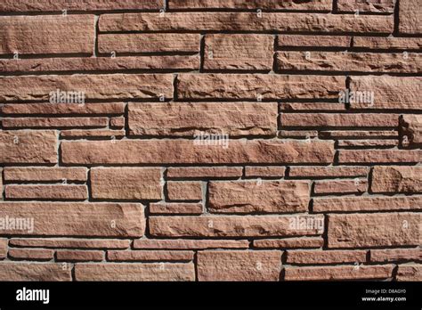 red sandstone brick wall texture Stock Photo - Alamy