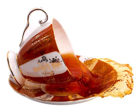 Spilled Tea in a Brown China Cup Photograph by Jennifer Delorme - Pixels