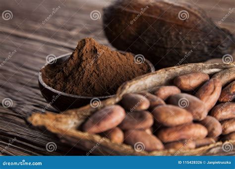 Cocoa Beans In The Dry Cocoa Pod Fruit On Wooden Background Stock Photo ...