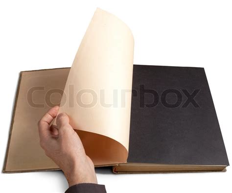 Hand turning page | Stock image | Colourbox