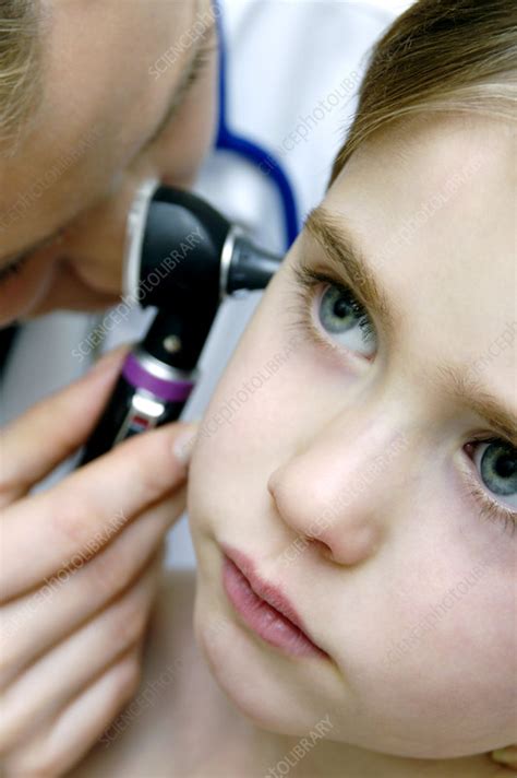 Ear examination - Stock Image - M825/0992 - Science Photo Library