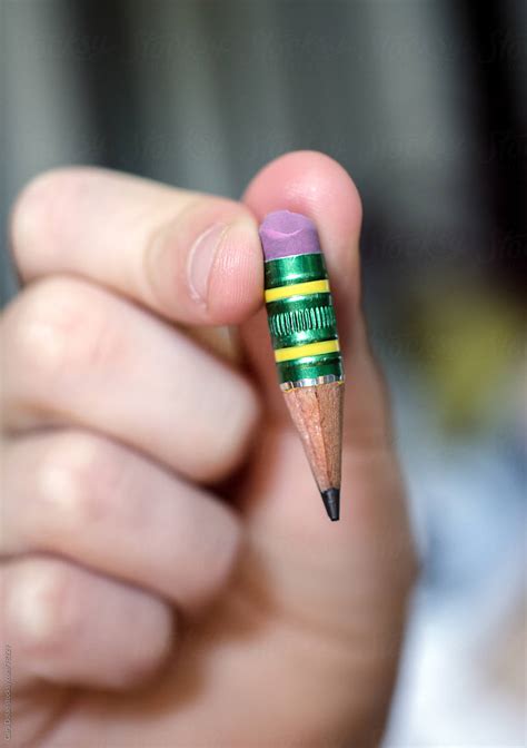 Child holds a pencil that has been sharpened to a nub by Cara Dolan ...