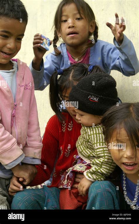 Many happy indian children making funny faces playing outdoors in India ...