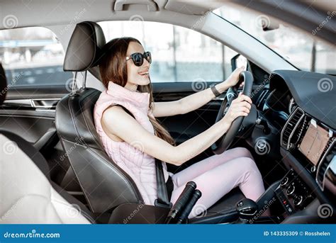 Sports woman driving a car stock image. Image of runner - 143335309