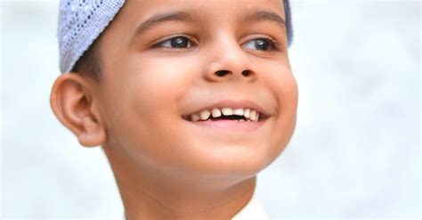 Portrait of a Boy Wearing a Taqiyah Cap · Free Stock Photo