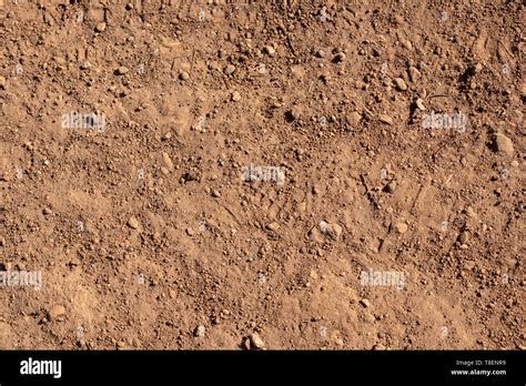 Red dirt road texture soil background Stock Photo - Alamy